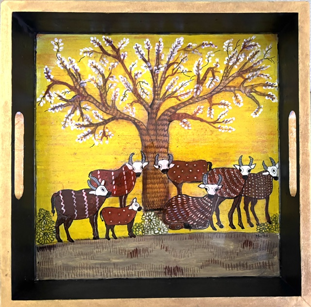 Wooden tray hand-painted by Maithili Joshi: cattle beneath a blossoming tree