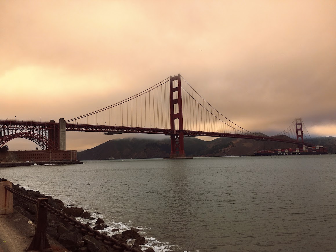 Golden Gate Bridge under a hazy sunset sky, photographed by Maithili Joshi